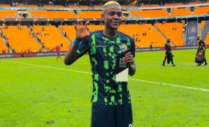 Daniel Msendami after receiving a Man of the Match Award