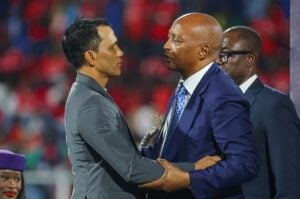 Fadlu Davids with CAF President Patrice Motsepe during the CAF Confederations Cup medal ceremony