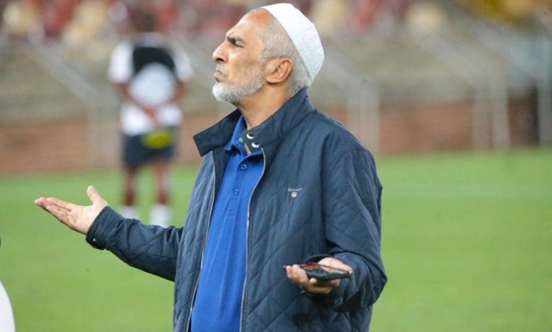 Farouk Kadodia talking to a team official at Peter Mokaba Stadium