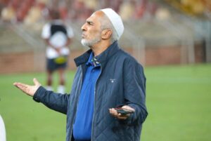Farouk Kadodia talking to a team official at Peter Mokaba Stadium