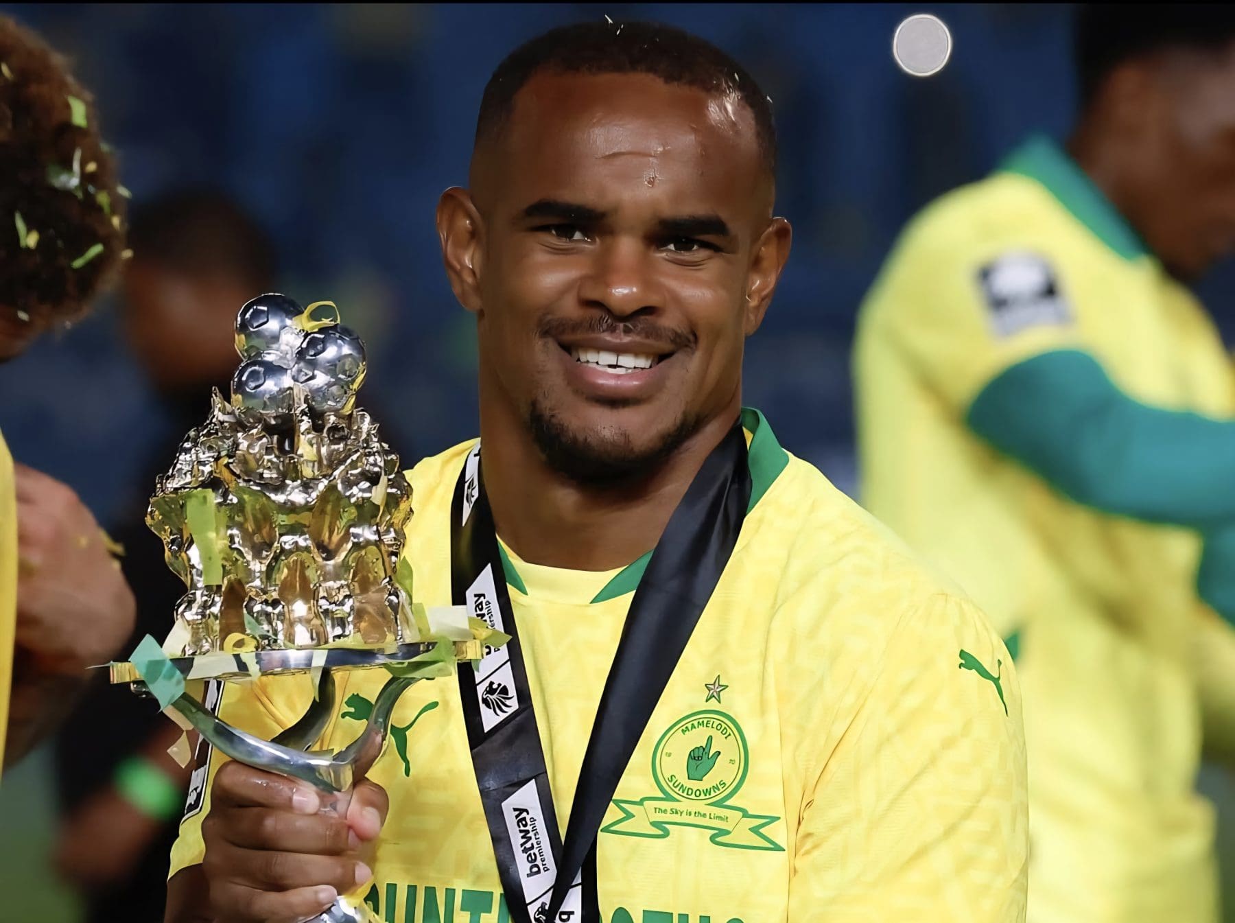 Iqraam Rayners holding a Betway Premiership trophy after winning it with Mamelodi Sundowns 