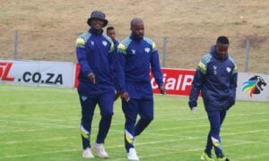 Kruger United players pitch inspection before a game in the PSL