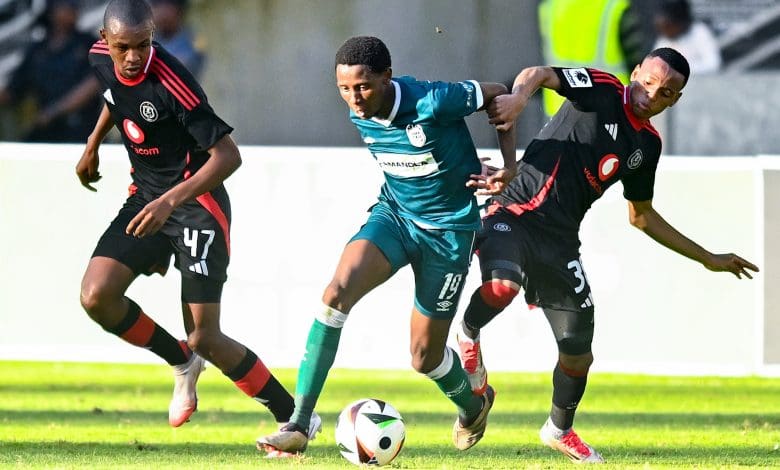 Tshepang Moremi dribbles past the Orlando Pirates players at Moses Mabhida Stadium.