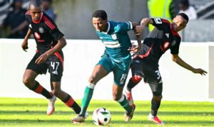 Tshepang Moremi dribbles past the Orlando Pirates players at Moses Mabhida Stadium.