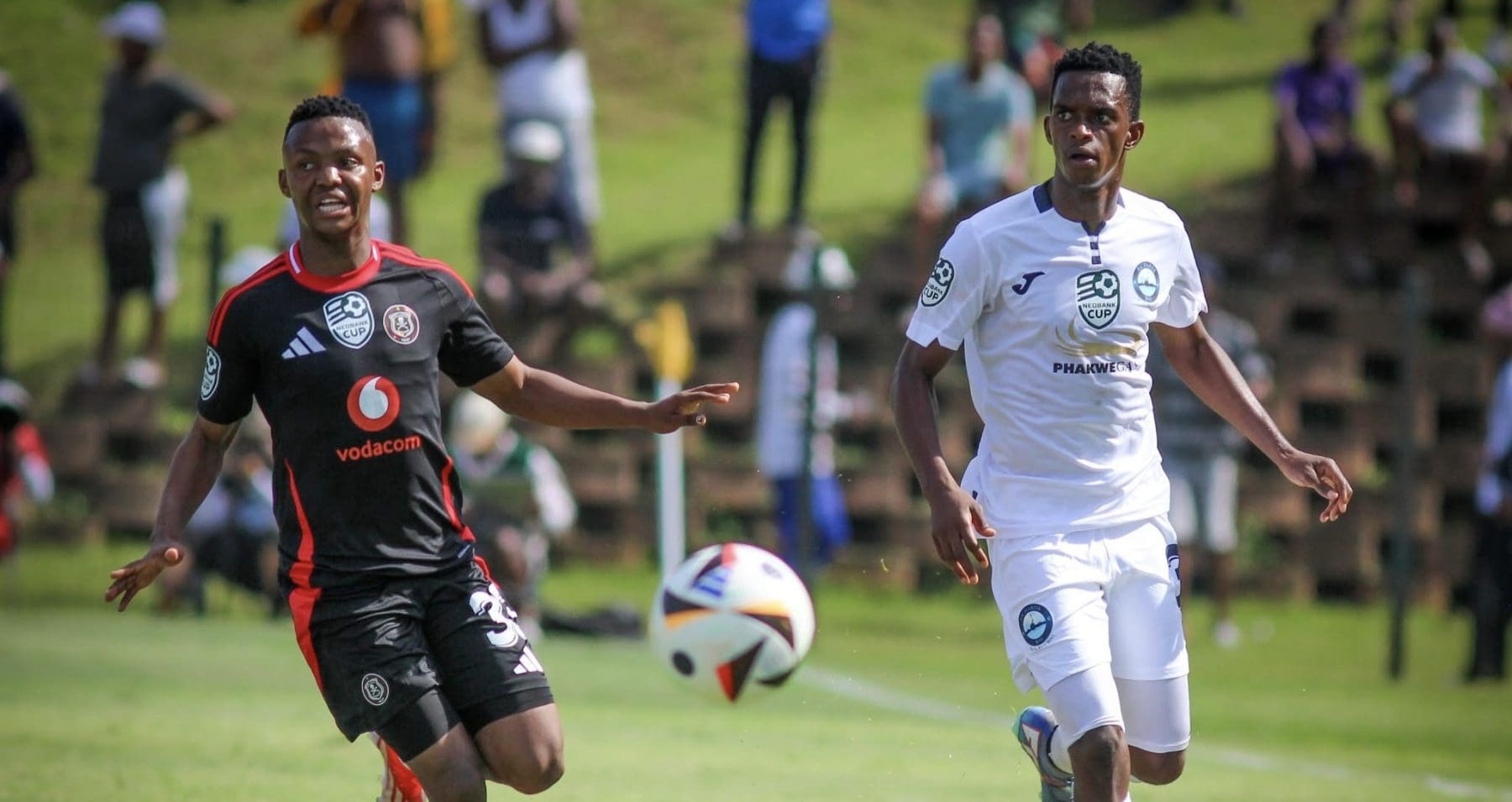 Orlando Pirates’ Mohau Nkota and Richards Bay FC’s Nkosikhona Ndaba in action