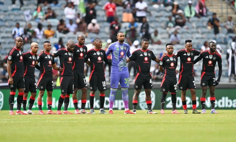Orlando Pirates players doing a moment of silence ahead of the match