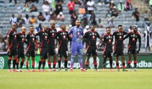 Orlando Pirates players doing a moment of silence ahead of the match