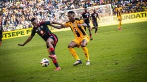 Orlando Pirates' Mohau Nkota and Kaizer Chiefs' Pule Mmodi battling for a ball