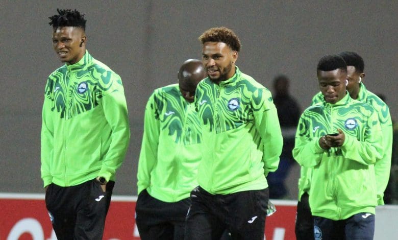 Richards Bay FC players doing a pitch inspection
