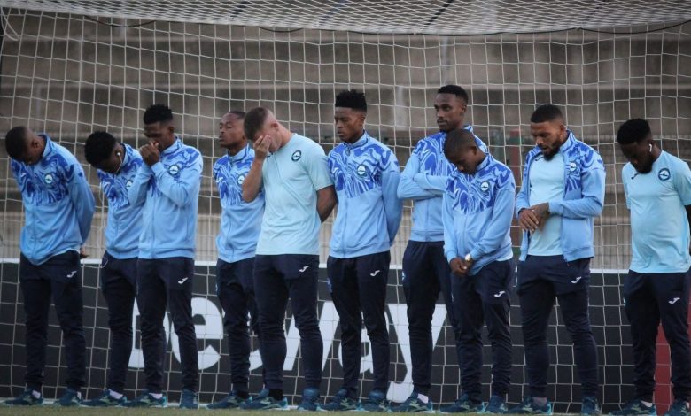 Richards Bay FC players praying during the pitch inspection