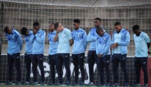 Richards Bay FC players praying during the pitch inspection