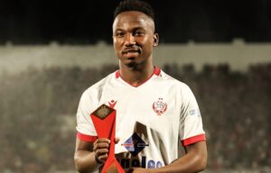 Cassius Mailula holding a man of the match trophy at Wydad AC