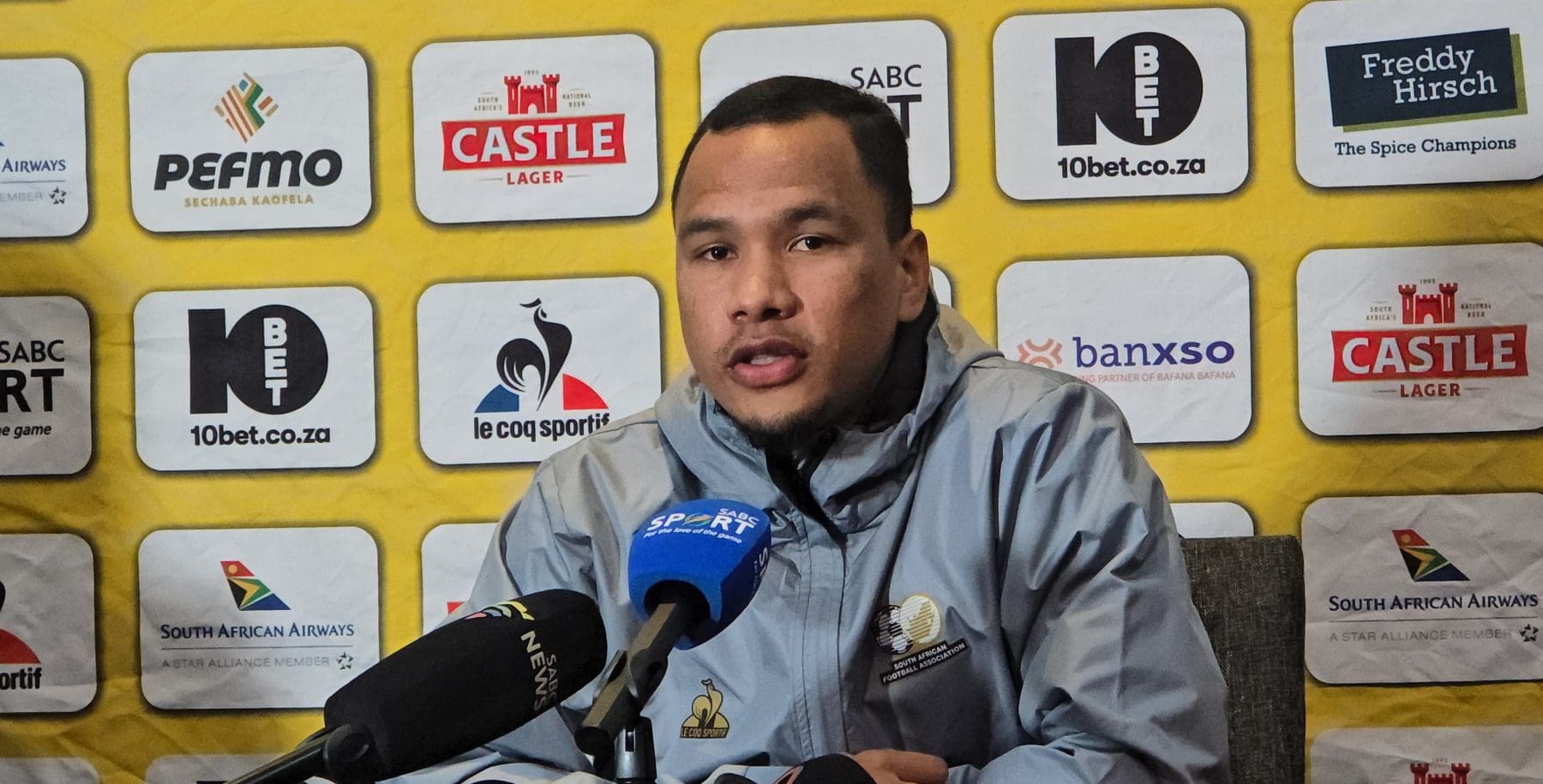 Bafana Bafana defender Fawaaz Basadien addressing the media