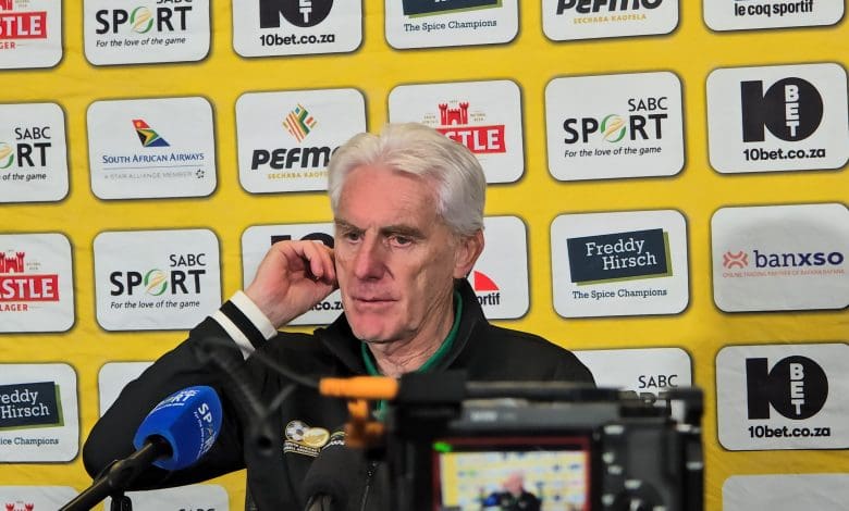 Hugo Broos addressing the media after the draw against Tanzania