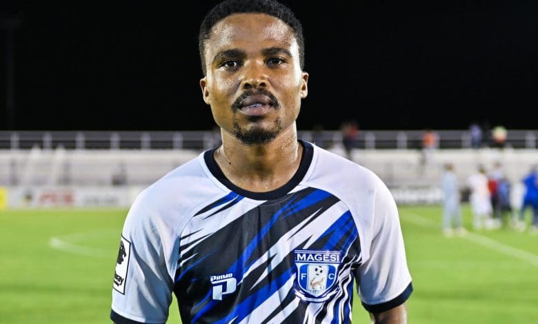 John Mokone holding a man of the match trophy