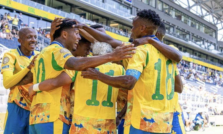 Mamelodi Sundowns players celebrating a goal in a match against Borussia Dortmund