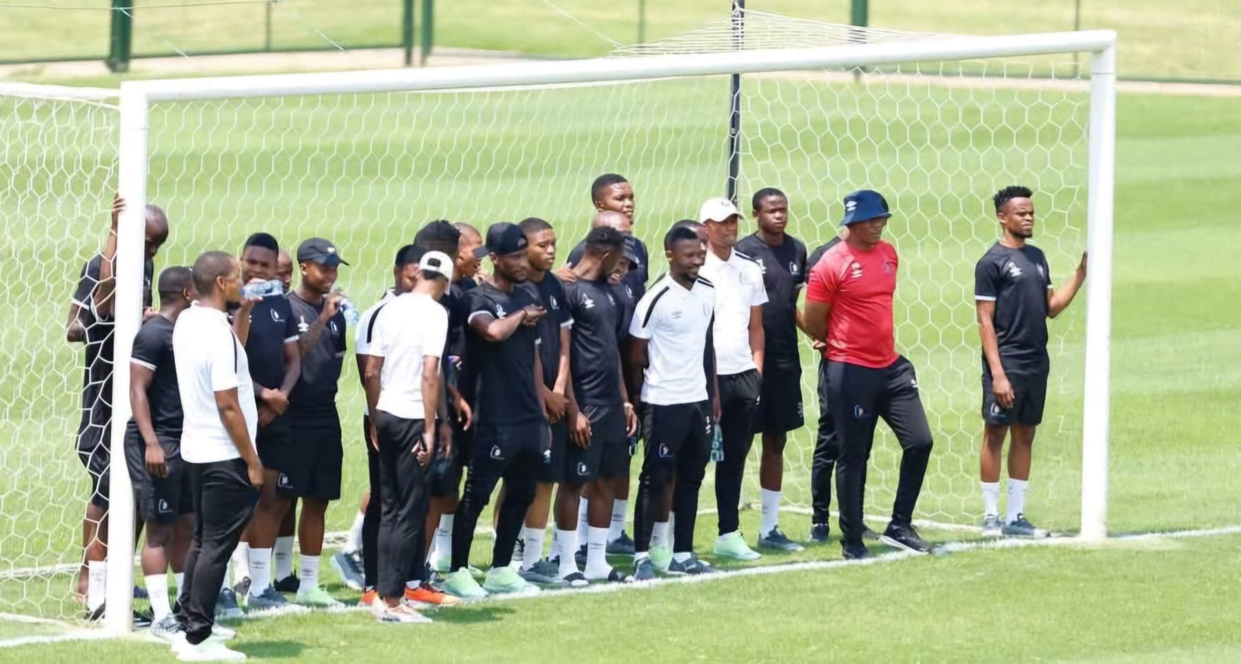 Orbit College players’ line-up inside the nets before a League match 