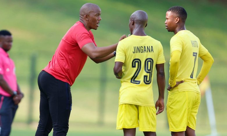 Orbit College FC coach Pogiso Makhoye and two players