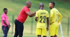 Orbit College FC coach Pogiso Makhoye and two players