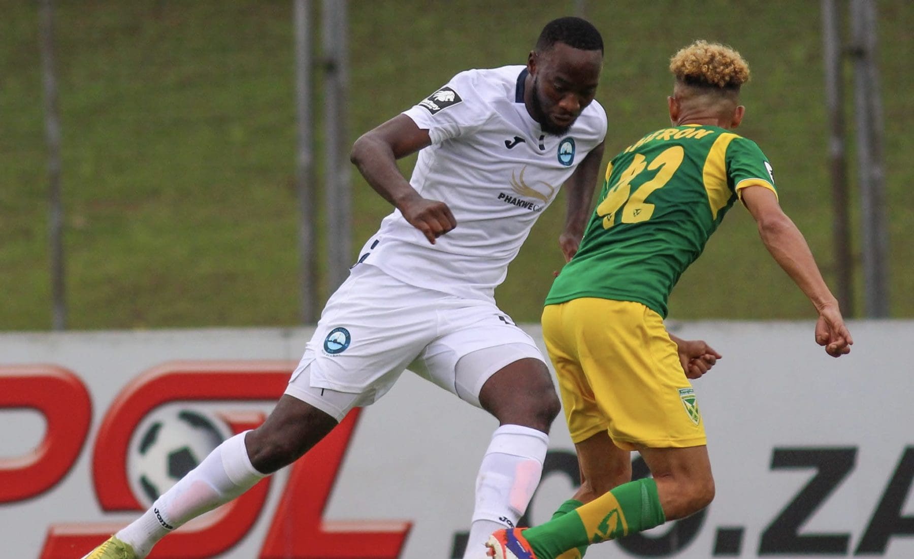 Richards Bay FC attacker Somila Ntsundwana and Golden Arrows’ Brandon Theron fighting for the ball 