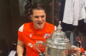 Jethren Barr holding a Sports Direct FAI Cup