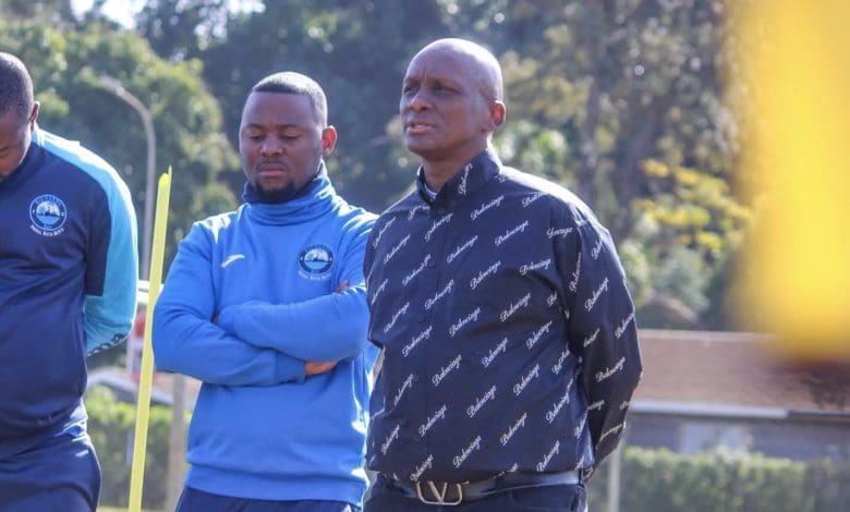 Richards Bay FC chairman Jomo Biyela speaking with players