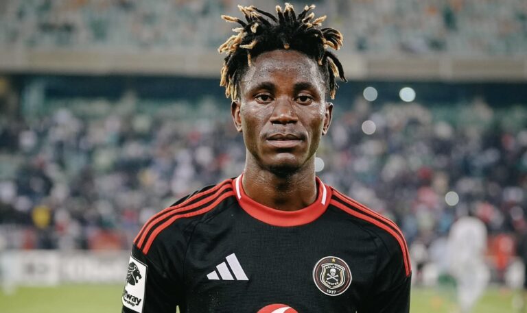 Orlando Pirates attacking midfielder Karim Kimvuidi holding a man of the match trophy