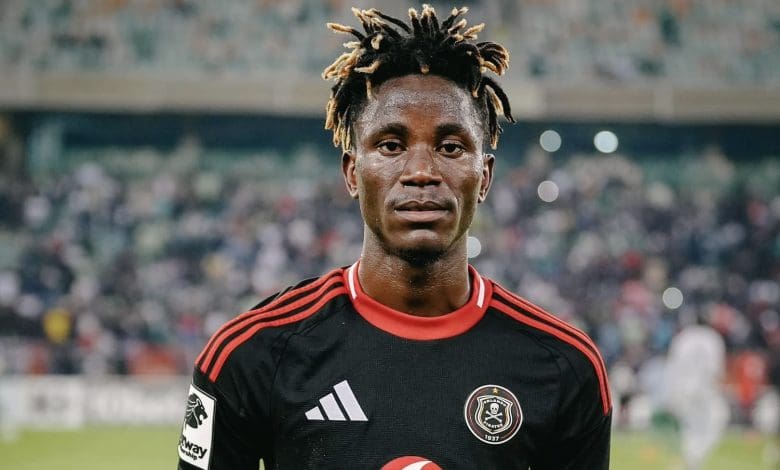 Orlando Pirates attacking midfielder Karim Kimvuidi holding a man of the match trophy