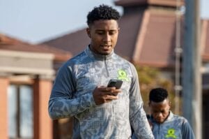 Brazilian forward Lucas Ribeiro Costa on his phone