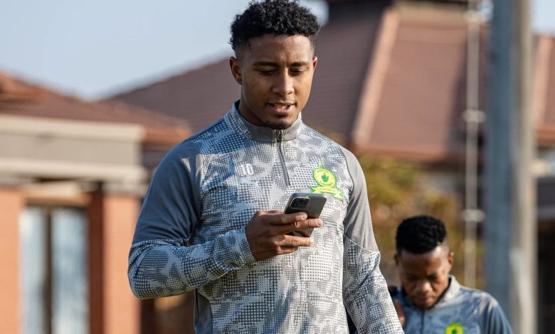 Brazilian forward Lucas Ribeiro Costa on his phone