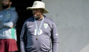 Golden Arrows coach Manqoba Mngqithi walking during training