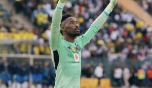 Orlando Pirates goalkeeper Sipho Chaine celebrating a win
