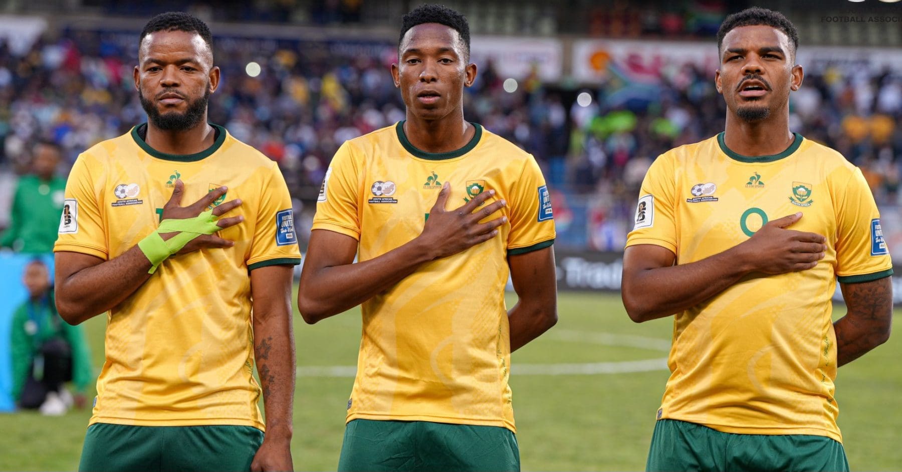Sipho Mbule, Thalente Mbatha and Lyle Foster singing the national anthem for Bafana Bafana