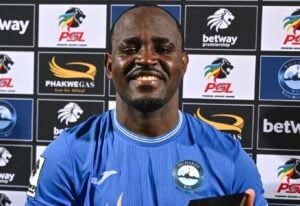 Gabadinho Mhango holding up MOTM trophy