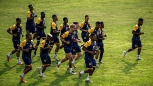 Kaizer Chiefs players warm up before a game
