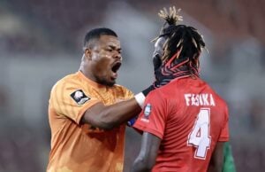 Stanley Nwabali shouting to his defender Nathan Fasika during a match
