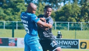 Richards Bay and Durban City players wrestle for the ball.