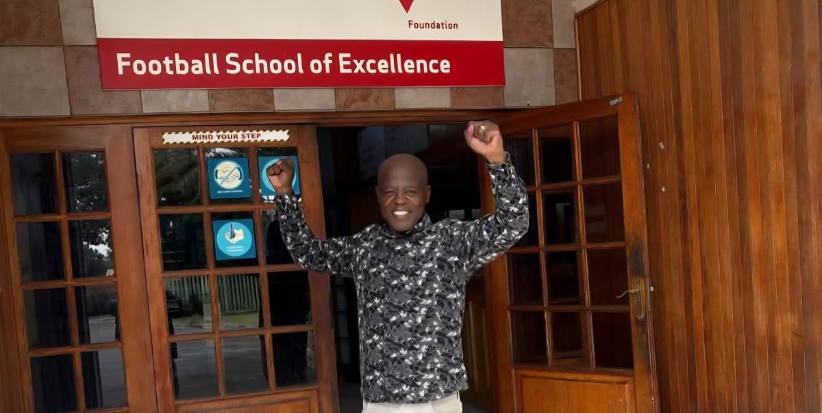 Chippa Mpengesi in front of the School of Excellence door