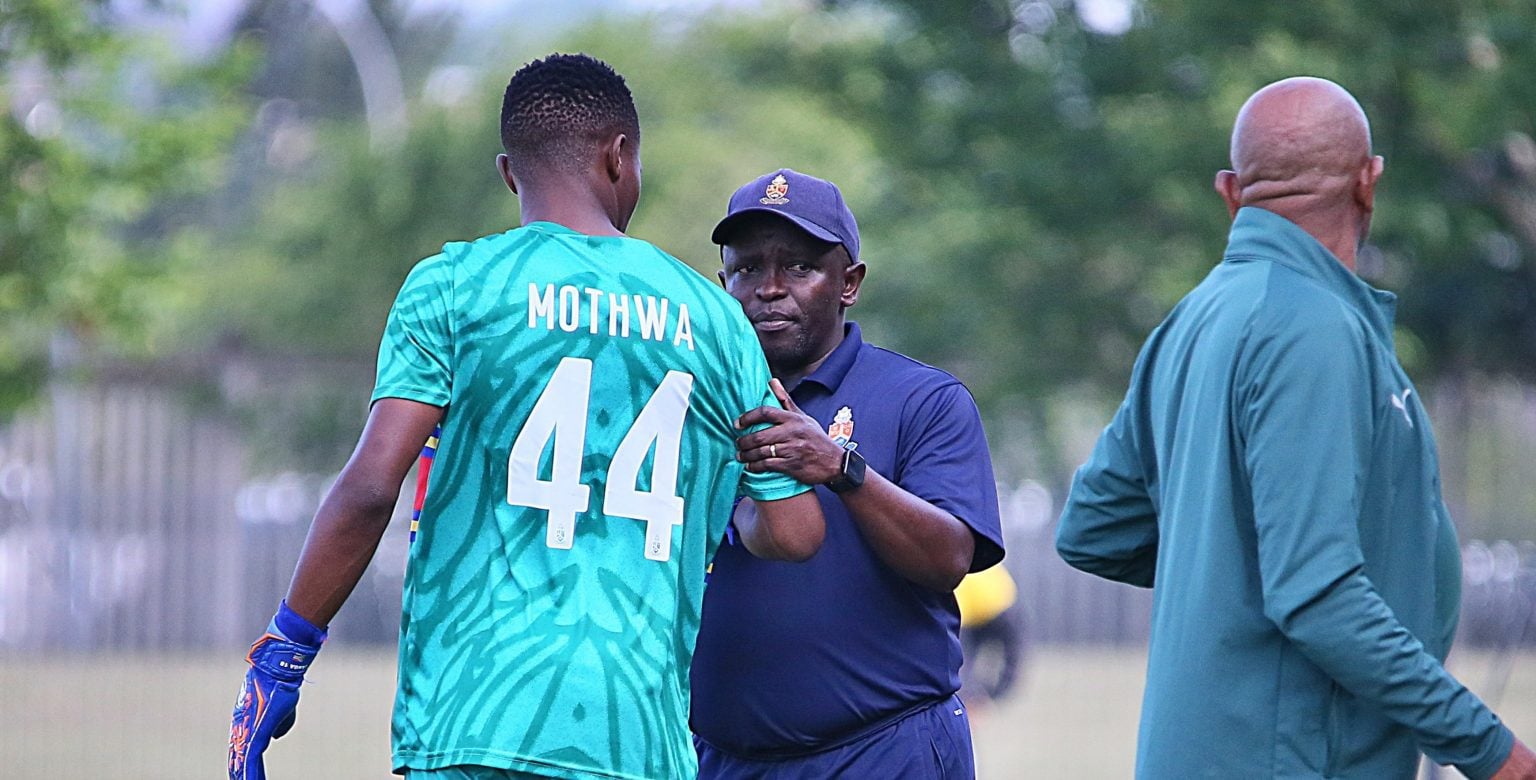 Sbongakonke Mgwaba and Kwanele Kopo on the touchline during a League match.