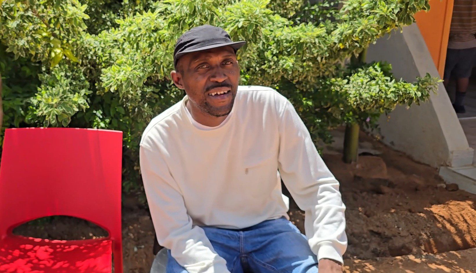 Lerato Chabangu sitting on a chair during his time at the Hope of Achievers Rehabilitation Centre.