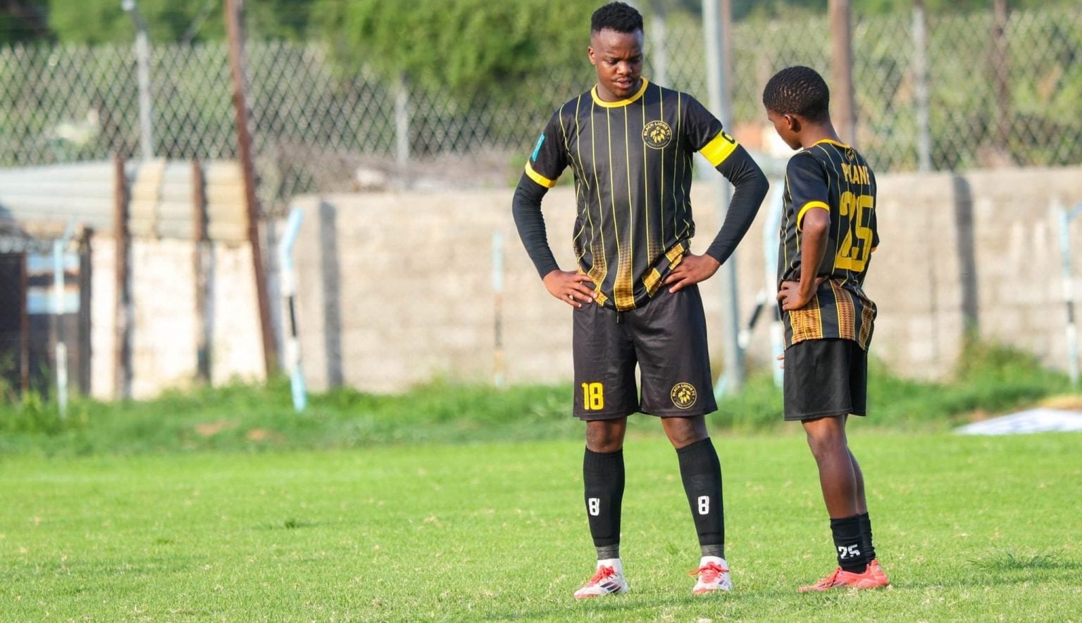 On loan Kaizer Chiefs defender Xolani Cossa with a teammate at Black Lions FC