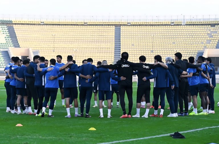 Zamalek SC players praying before a training session