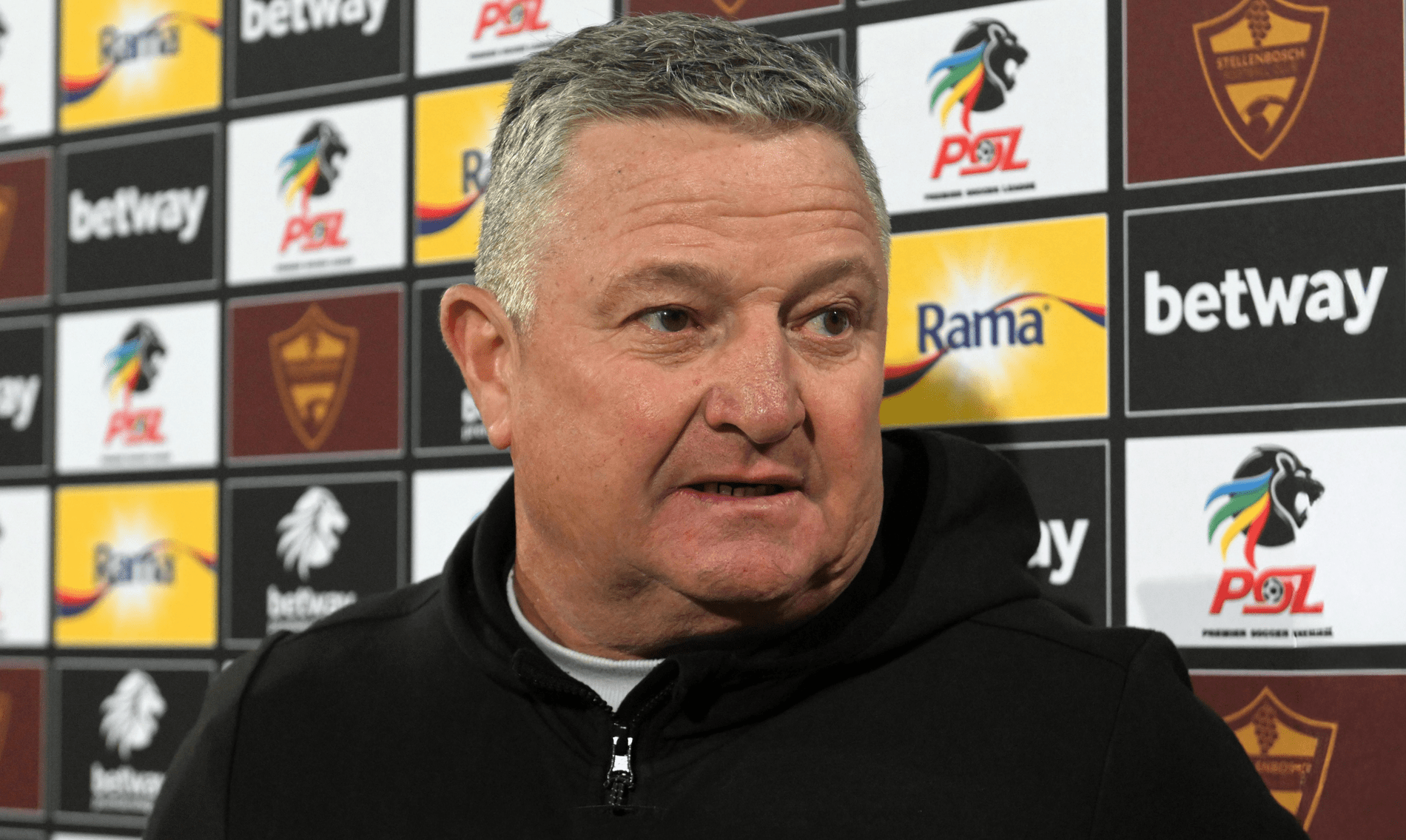 Coach Gavin Hunt addressing members of the media