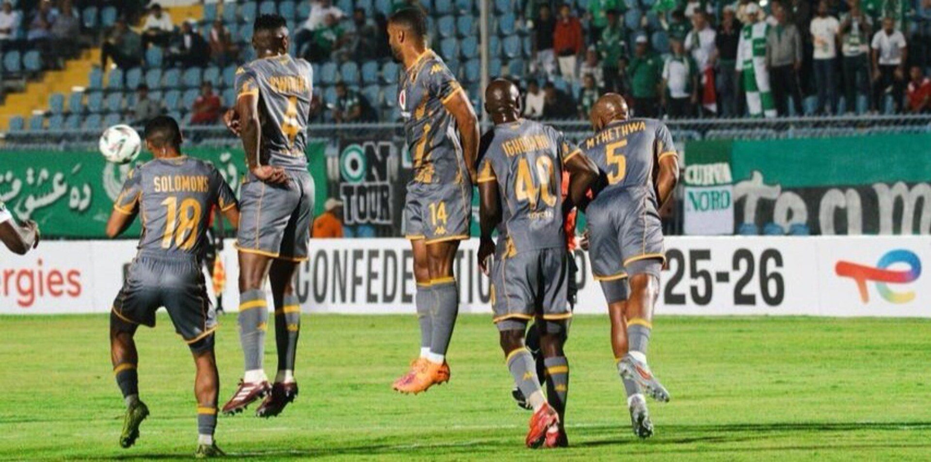 Kaizer Chiefs players defending a freekick