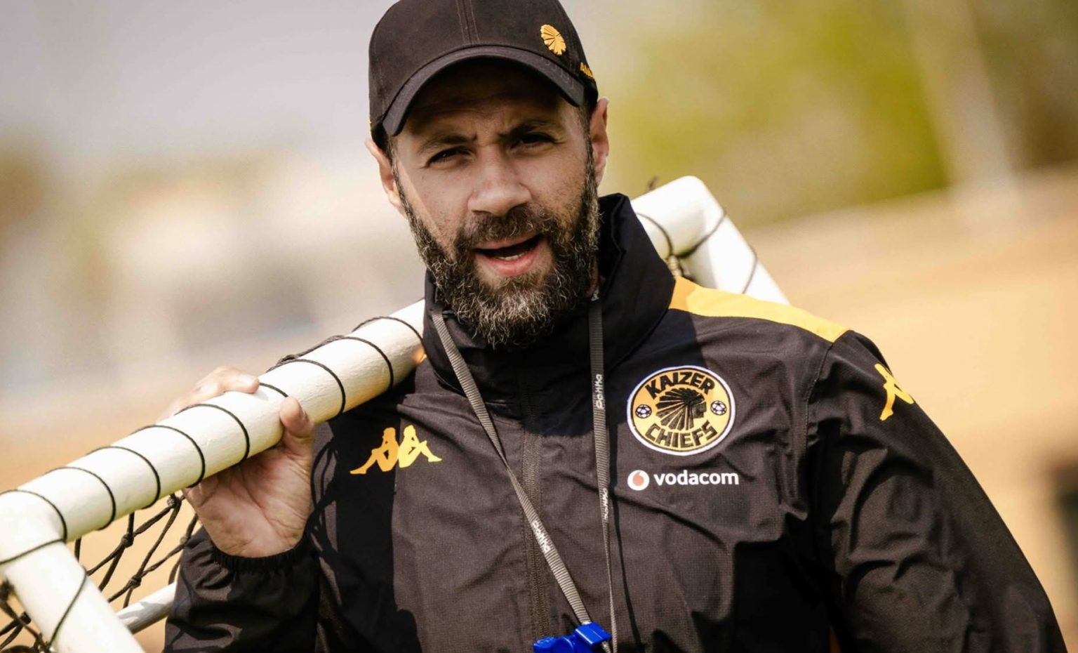 Kaizer Chiefs co-coach Khalil Ben Youssef holding a pole during a training session.