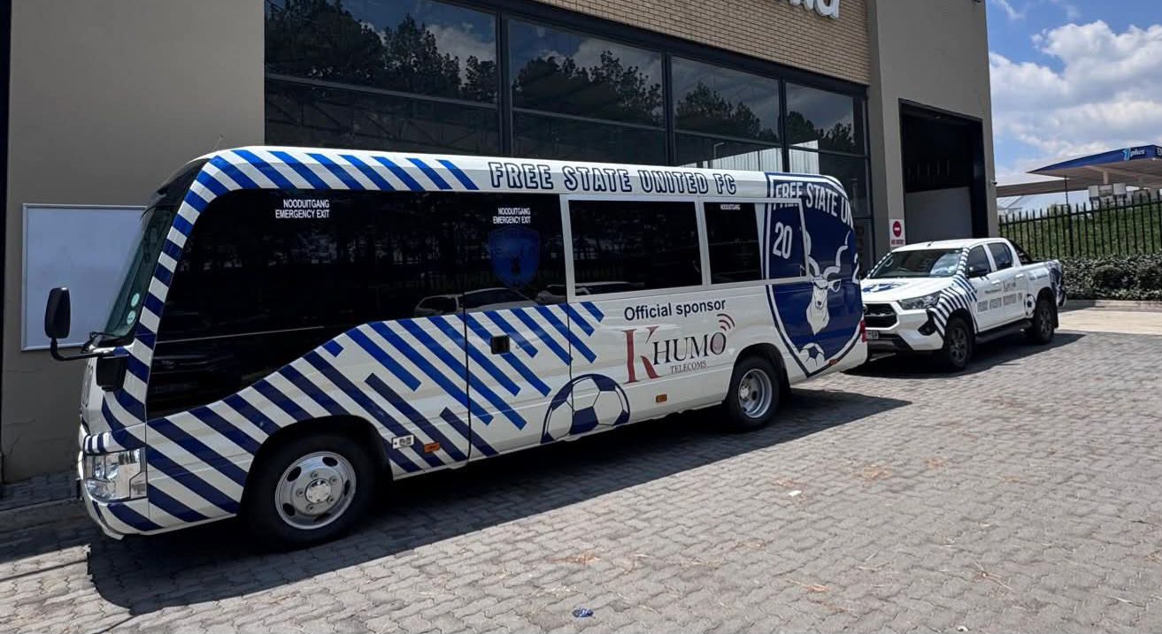 Free State United FC bus packed outside of a building