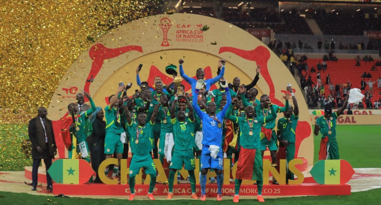 The Senegal national team lift the Africa Cup of Nations Trophy after beating Morocco.