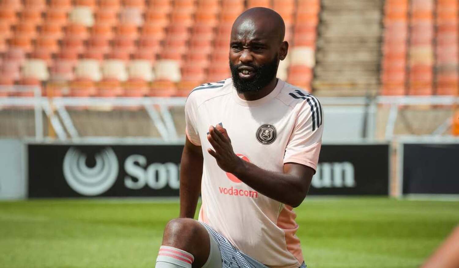 Orlando Pirates midfielder Makhehlene Makhaula warming up