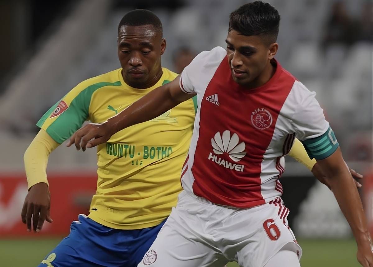 Travis Graham challenged by Mamelodi Sundowns' Sibusiso Vilakazi at the DHL Stadium during a Premier Soccer League clash. Image: travisxgraham/ Instagram