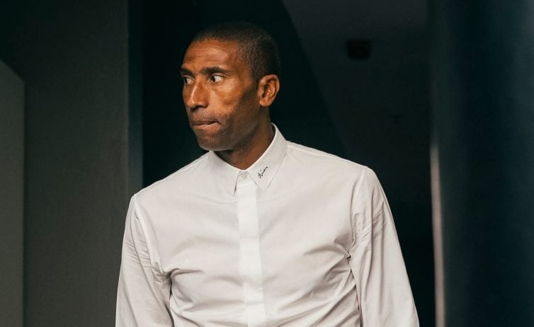 Orlando Pirates coach Abdeslam Ouaddou arriving at the stadium wearing a shite shirt.